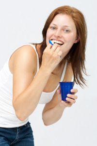 Woman brushing teeth