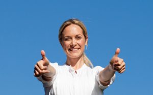 woman with her thumbs up